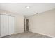Bright bedroom with wood-look flooring and access to an ensuite bathroom at 15690 Sw 46Th Cir, Ocala, FL 34473