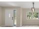 Bright entryway with a large window offering views of tropical landscaping at 15690 Sw 46Th Cir, Ocala, FL 34473