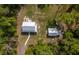 Aerial view of home, yard, metal roof, and detached garage at 3333 Se 3Rd Ave, Ocala, FL 34471