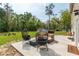 Spacious patio featuring modern outdoor furniture in a landscaped backyard at 3333 Se 3Rd Ave, Ocala, FL 34471