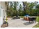 Backyard features furniture, grill, playhouse, and other outdoor equipment at 3333 Se 3Rd Ave, Ocala, FL 34471