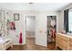 bedroom with ample room, open closet, and wood laminate flooring at 3333 Se 3Rd Ave, Ocala, FL 34471