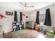 Bright Bedroom with themed decor, ceiling fan, and vinyl flooring at 3333 Se 3Rd Ave, Ocala, FL 34471