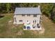 Aerial shot of a home with a well kept lawn, a back patio with outdoor seating and backyard at 3333 Se 3Rd Ave, Ocala, FL 34471