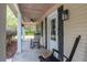 Charming front porch featuring rocking chairs and a welcoming entrance at 3333 Se 3Rd Ave, Ocala, FL 34471