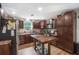The kitchen is equipped with dark cabinets, stainless steel appliances, and wooden countertops at 3333 Se 3Rd Ave, Ocala, FL 34471
