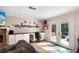 Well-lit living room workspace includes a built-in desk, shelving, and a view to the outdoors at 3333 Se 3Rd Ave, Ocala, FL 34471