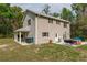 Back of a two-story home featuring a patio, yard space, and exterior features at 3333 Se 3Rd Ave, Ocala, FL 34471