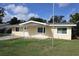 Charming single-story home with a well-maintained lawn and inviting entrance at 124 Auburn Rd, Auburndale, FL 33823