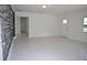 Expansive living area boasts modern flooring, fresh paint, and abundant natural light at 124 Auburn Rd, Auburndale, FL 33823
