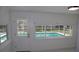 View of the swimming pool from the interior of the home at 124 Auburn Rd, Auburndale, FL 33823