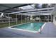 Enjoy the large screened pool with a spacious deck, perfect for relaxing and entertaining at 124 Auburn Rd, Auburndale, FL 33823