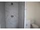 Elegant shower with white marble style tiles and modern fixtures at 124 Auburn Rd, Auburndale, FL 33823