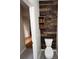 Nicely decorated powder room with featured accent wall and modern fixtures at 9826 Poplar Pl, Orlando, FL 32827