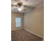 Carpeted bedroom featuring ceiling fan and window at 9826 Poplar Pl, Orlando, FL 32827