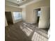 Bedroom with a ceiling fan, plush carpet, and an attached closet and en-suite bath at 9826 Poplar Pl, Orlando, FL 32827