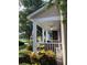 Cozy covered front porch with fan and ample seating for relaxing outdoors at 9826 Poplar Pl, Orlando, FL 32827