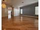 Spacious living room with hardwood floors and neutral paint, perfect for relaxing or entertaining at 9826 Poplar Pl, Orlando, FL 32827