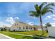 Exterior view of home backyard with spacious lawn, covered patio, and ample natural light at 1720 Reflection Ln, St Cloud, FL 34771