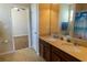 Bathroom featuring double vanity and wood look flooring at 1720 Reflection Ln, St Cloud, FL 34771
