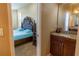 En Suite Bathroom with split vanity and shared access to a bedroom with a king-sized bed at 1720 Reflection Ln, St Cloud, FL 34771