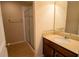 This bathroom features a glass enclosed shower and granite topped vanity at 1720 Reflection Ln, St Cloud, FL 34771