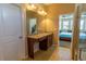 En Suite Bathroom view of a bedroom with a king-sized bed at 1720 Reflection Ln, St Cloud, FL 34771