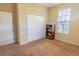 Cozy carpeted bedroom features a closet for ample storage at 1720 Reflection Ln, St Cloud, FL 34771