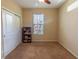Bright carpeted bedroom features natural light and closet for storage at 1720 Reflection Ln, St Cloud, FL 34771