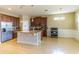 Spacious kitchen with granite countertops, stainless appliances, dark cabinets, and tile flooring at 1720 Reflection Ln, St Cloud, FL 34771