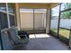 A screened in outdoor patio with outdoor furniture at 1720 Reflection Ln, St Cloud, FL 34771