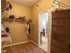 This walk-in closet has built in shelves and a neutral colored carpet at 1720 Reflection Ln, St Cloud, FL 34771