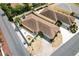 An aerial view shows a well-maintained home with lush landscaping, a private patio, and a convenient two-car garage at 1139 Santa Cruz Dr, The Villages, FL 32162