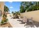 Private backyard with an arrangement of chairs, landscaping, and lots of space to entertain at 1139 Santa Cruz Dr, The Villages, FL 32162