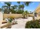 Private backyard featuring a seating area, well-manicured landscaping, and a peaceful outdoor setting at 1139 Santa Cruz Dr, The Villages, FL 32162