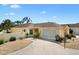 Charming one-story home featuring a well-manicured yard, a two car garage, and a neutral color palette at 1139 Santa Cruz Dr, The Villages, FL 32162
