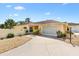 Charming single-story home with a two-car garage, mature landscaping, and a well-manicured lawn at 1139 Santa Cruz Dr, The Villages, FL 32162