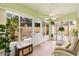 Bright sunroom with large windows, a ceiling fan, tile flooring, and comfortable seating at 1139 Santa Cruz Dr, The Villages, FL 32162