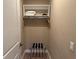 A closet featuring shelves and hanging rod offers storage with a convenient luggage rack at 3060 Rockefeller Way # 156, Kissimmee, FL 34747