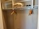 A closet featuring shelves and hanging rod providing storage with a convenient luggage rack at 3060 Rockefeller Way # 156, Kissimmee, FL 34747