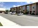 View of exterior buildings with modern architecture and manicured landscaping at 3060 Rockefeller Way # 156, Kissimmee, FL 34747