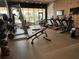 Modern gym featuring exercise machines, free weights, and floor to ceiling windows at 3060 Rockefeller Way # 156, Kissimmee, FL 34747