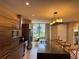Modern kitchen featuring stainless appliances, an island with seating, and wood cabinetry at 3060 Rockefeller Way # 156, Kissimmee, FL 34747