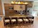 Modern kitchen with large island, stainless steel appliances, and stylish seating at 3060 Rockefeller Way # 156, Kissimmee, FL 34747