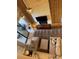 View of the living room with plush seating, modern lighting, and a stone feature wall at 3060 Rockefeller Way # 156, Kissimmee, FL 34747