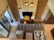View of the living room with plush seating, modern lighting, and a stone feature wall at 3060 Rockefeller Way # 156, Kissimmee, FL 34747