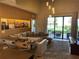 Modern living room with comfortable seating, stylish decor, and access to patio at 3060 Rockefeller Way # 156, Kissimmee, FL 34747