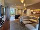 Open living space with modern kitchen, comfortable seating, and stylish decor at 3060 Rockefeller Way # 156, Kissimmee, FL 34747