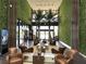 Stunning building lobby with green walls, palm trees and stylish seating at 3060 Rockefeller Way # 156, Kissimmee, FL 34747