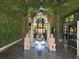 Elegant lobby featuring palm trees, green walls, and terracotta soldier statues at 3060 Rockefeller Way # 156, Kissimmee, FL 34747